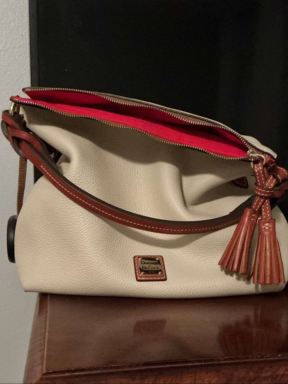 Dooney & Bourke Cream Leather Shoulder Bag with Brown Trim and Red Lining